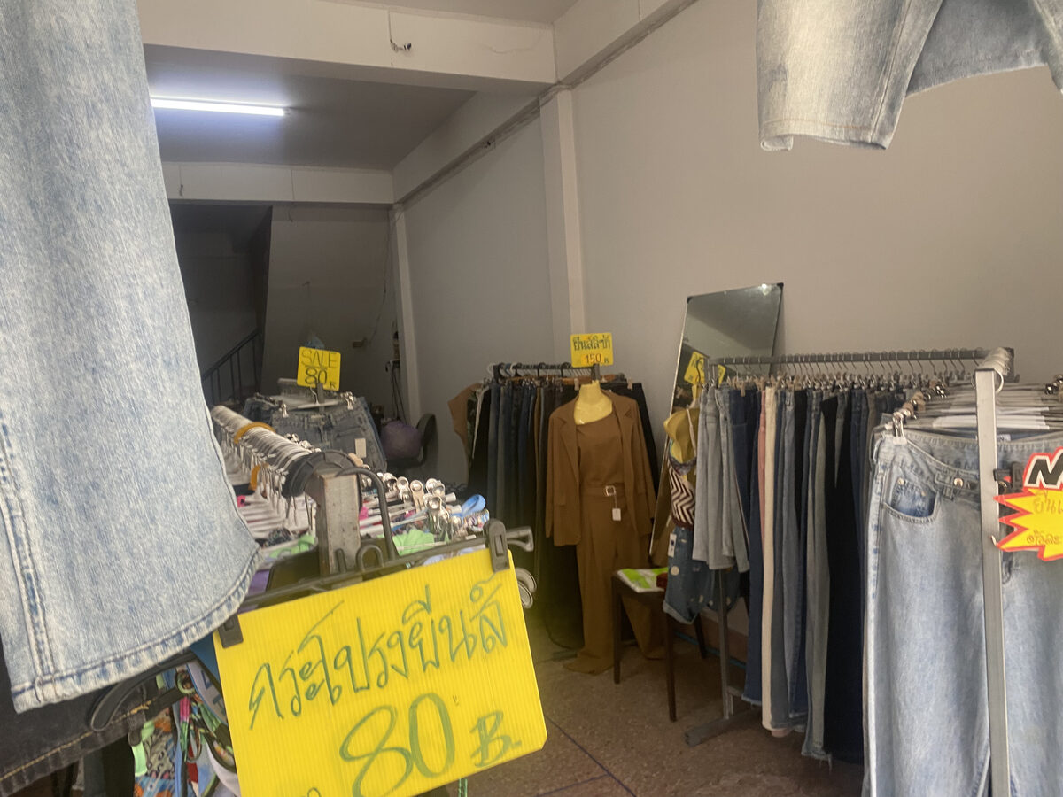 Denim racks and a mannequin display inside Dokmai Vintage Denim