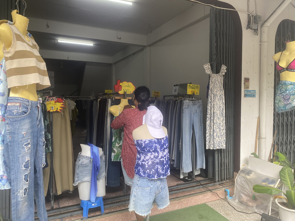 Storefront view of Dokmai Vintage Denim with jeans and dresses on display